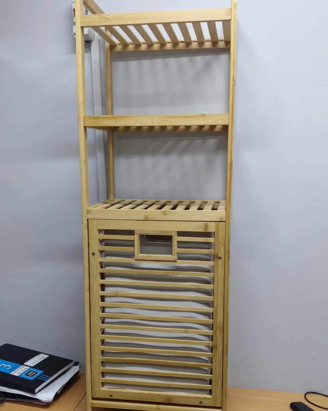 Laundry basket with three-tier shelf for towels and detergents