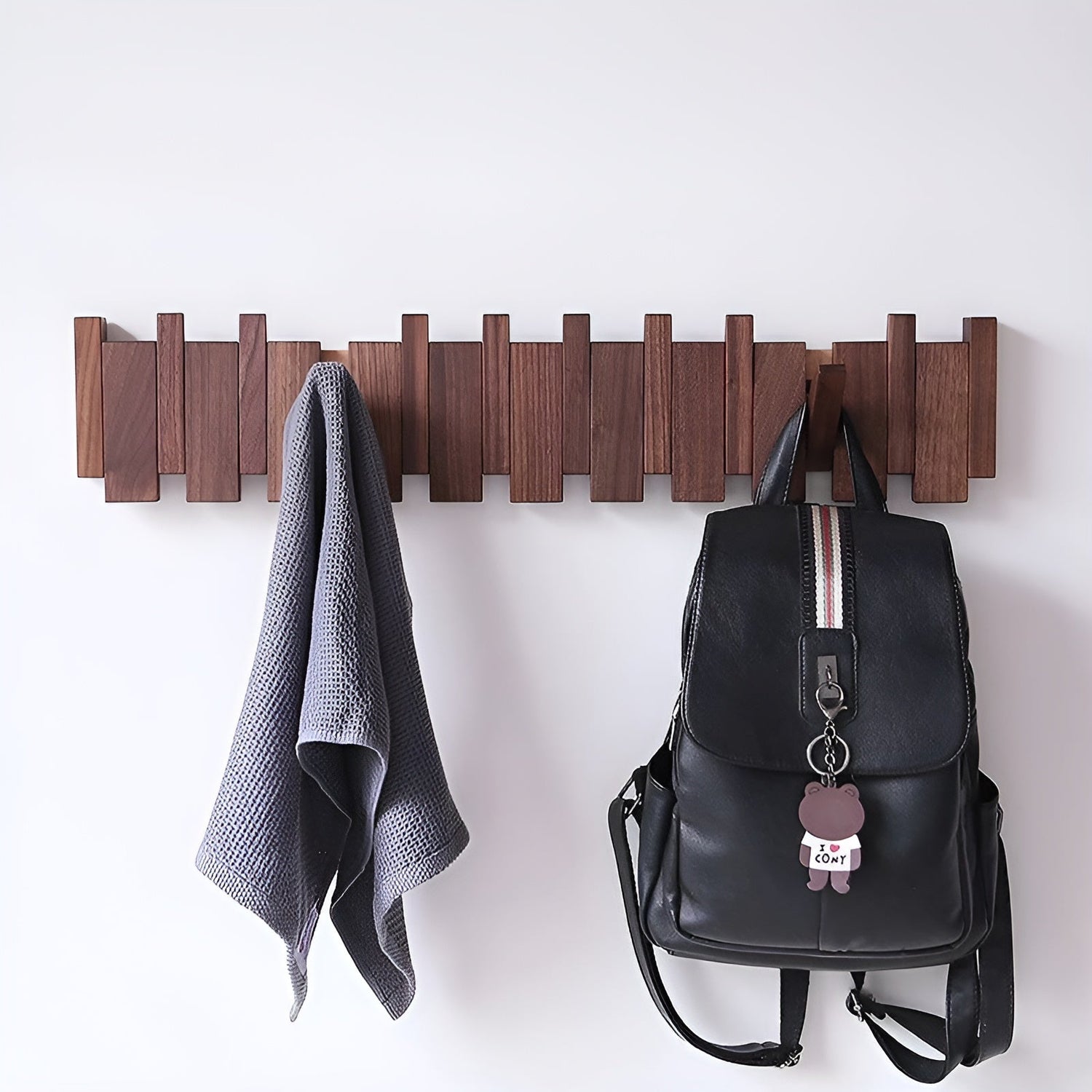 Decorative wooden wall hook shelf in entryway
