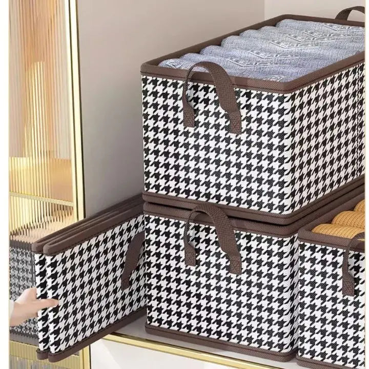 Foldable brown wardrobe organiser with reinforced sides and handles for storing folded clothes on wardrobe shelves