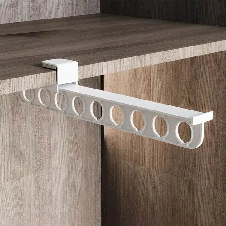 Space saving trouser holder mounted inside wardrobe