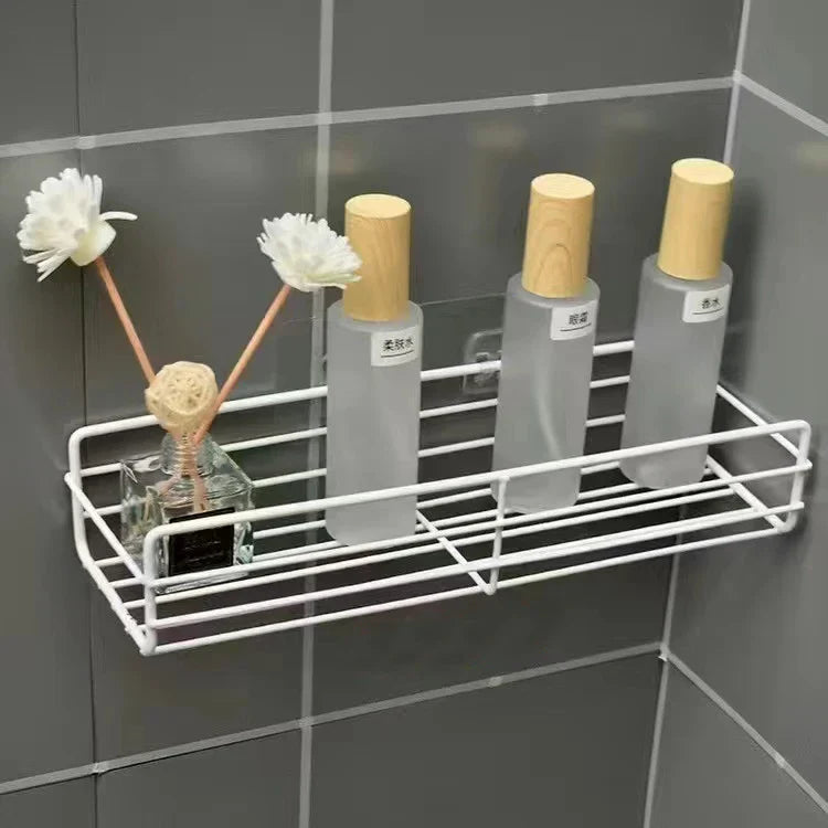 Bathroom organizer shelf installed on tiled wall